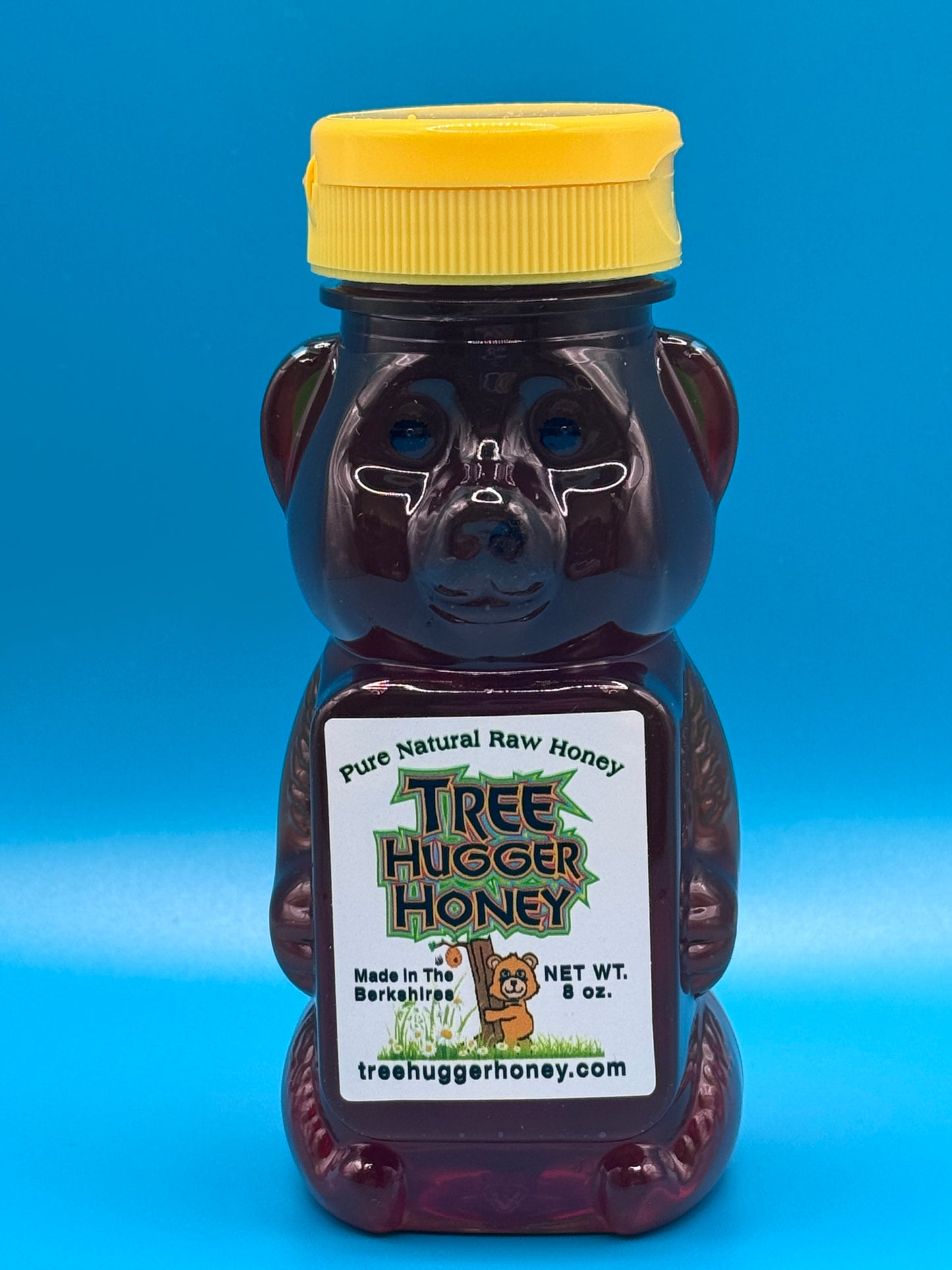 8 ounce plastic bear of natural raw honey.